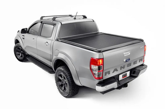 Ford Ranger with a black retractable truck bed cover.