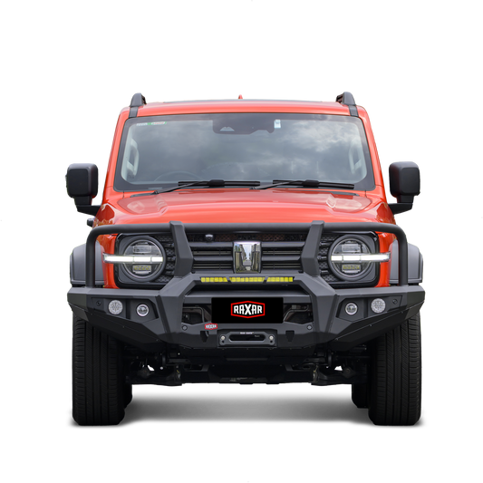 Front view of an orange SUV with rugged bumper and accessories.