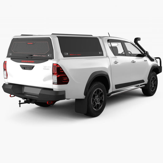 A sleek white pickup truck with a black camper shell.