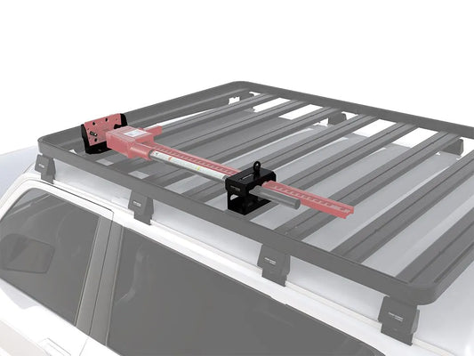Roof rack with mounted Hi-Lift jack bracket for vehicle recovery gear.