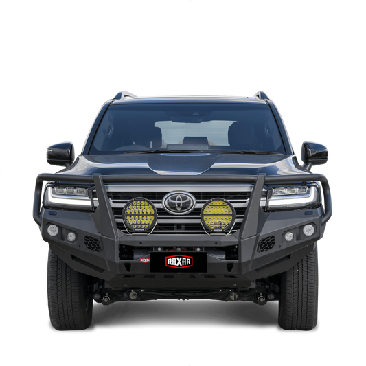 Front view of a rugged off-road SUV with protective bull bar and lights.