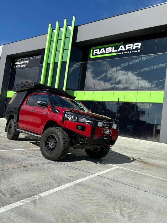 Red Toyota 4x4 equipped with Raslarr Engineering gear.