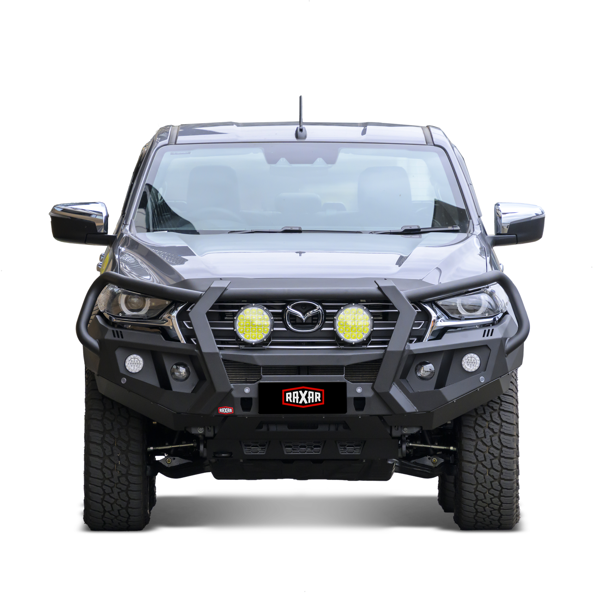 Mazda pickup with rugged bull bar and mounted auxiliary lights.