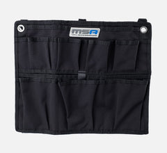 MSA tool organizer with multiple black pockets and two metal eyelets for hanging.