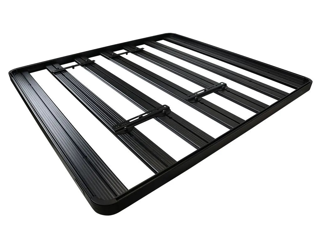 Flat roof rack with slats, mounted solar panel in center.