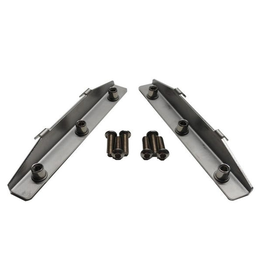 Two metal V-shaped brackets with embedded bolts and additional loose bolts. 600