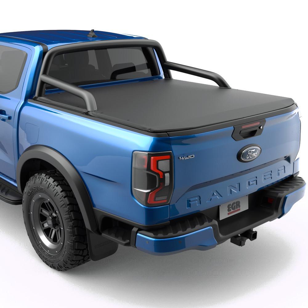 Blue Ford Ranger with a sleek tonneau cover and robust roll bars.