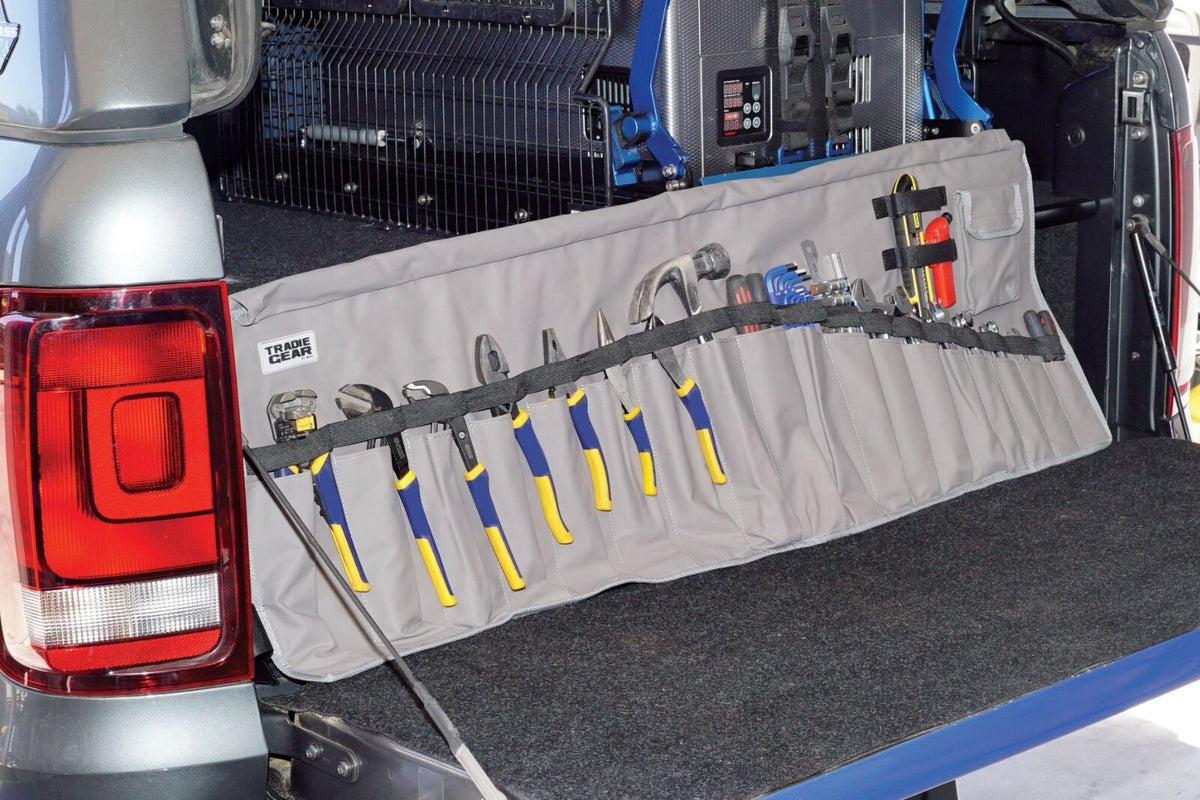 Tool organizer with multiple pouches for secure tool storage.