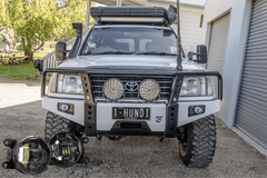 105 Series Dallas Bull Bar with STEDI Universal Type A LED Fog Light Kit mounted on a vehicle front view.