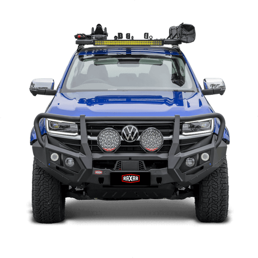 Blue off-road truck with a robust bumper and powerful spotlights