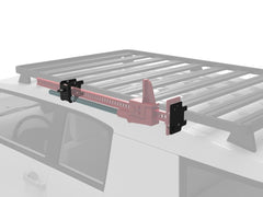 Car roof rack with adjustable mounting bracket attached.