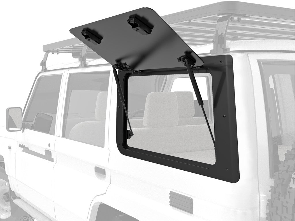 Vehicle with open side window framed in black, struts supporting the pane.