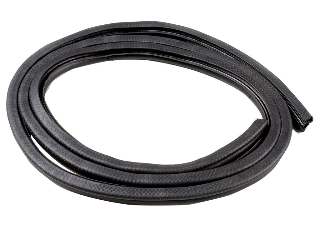 Coiled black rubber gasket on white background.