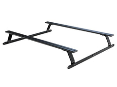 Black aluminum truck bed rack with two bars, adjustable legs for cargo support.