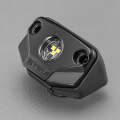 Black LED light accessory, two screws, STEDI brand, gray surface.