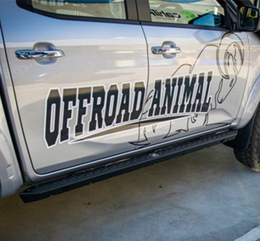 Side view of silver pickup truck with "OFFROAD ANIMAL" text, animal graphic. 588