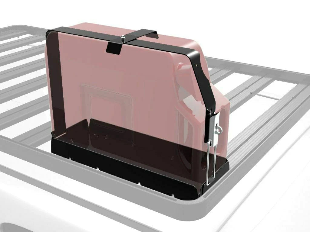 Transparent cover mounted on rooftop rack, securing rectangular object.